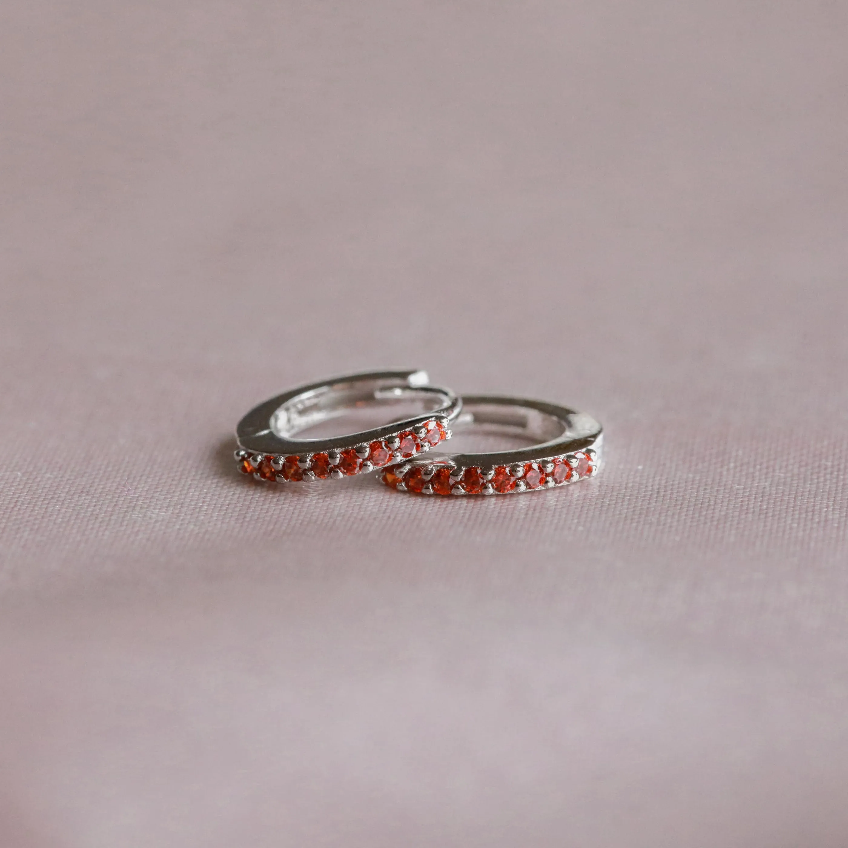 January Birthstone Huggies in Silver with Garnet CZ